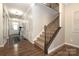 Elegant staircase with wrought iron railing at 14217 Ridgewater Way, Charlotte, NC 28278