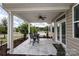 Covered patio with seating area and view of neighborhood at 14217 Ridgewater Way, Charlotte, NC 28278