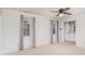 Primary bedroom with grey curtains and two windows at 8017 Regent Park Ln, Charlotte, NC 28210