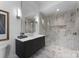 Modern bathroom with floating vanity, large shower, and marble tile at 2116 Woodhaven Rd, Charlotte, NC 28211