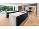 Modern kitchen with marble countertops, black cabinetry, and high-end appliances at 2116 Woodhaven Rd, Charlotte, NC 28211