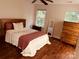 Bright bedroom with a double bed, dresser, and hardwood floors at 9507 Abson Ct, Charlotte, NC 28215