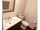 Clean bathroom with gray vanity and wood-look floor at 9507 Abson Ct, Charlotte, NC 28215