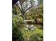 Serene backyard with fire pit and pond at 1409 Trinity Church Rd, Monroe, NC 28112