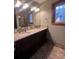 Bathroom with double vanity, granite countertops, and tile flooring at 1409 Trinity Church Rd, Monroe, NC 28112