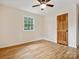 Hardwood floor bedroom with window and door at 24 Southbrook Dr, York, SC 27945