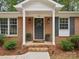 Gray front door with wreath, brick entryway, and landscaping at 24 Southbrook Dr, York, SC 27945