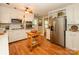 Kitchen boasts stainless steel appliances and hardwood floors at 325 Rosemary Ln, Gastonia, NC 28054