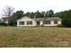 Ranch style home with a yellow exterior and red shutters at 8885 Brandon Cir, Concord, NC 28025