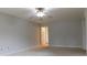 Well-lit bedroom with door to bathroom and ceiling fan at 8885 Brandon Cir, Concord, NC 28025