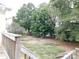 Landscaped backyard with mature trees and shrubs at 8885 Brandon Cir, Concord, NC 28025