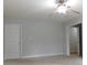 Bright bedroom featuring ceiling fan and access to other rooms at 8885 Brandon Cir, Concord, NC 28025