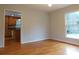Bright dining room with hardwood floors and access to the kitchen and living room at 8885 Brandon Cir, Concord, NC 28025