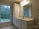 Bathroom with vanity, large mirror and window at 8885 Brandon Cir, Concord, NC 28025