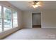 Living room with hardwood floors and access to other rooms at 8885 Brandon Cir, Concord, NC 28025