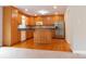 Kitchen with oak cabinets, stainless steel appliances, and an island at 8885 Brandon Cir, Concord, NC 28025