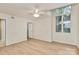 Hardwood floor bedroom with window and ceiling fan at 415 W 8Th St # F, Charlotte, NC 28202