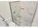 Bathroom with a large walk-in shower and marble tile at 415 W 8Th St # F, Charlotte, NC 28202