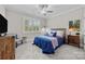 Bedroom with a queen-size bed, window with shutters, and plenty of natural light at 130 Bagby Rd, Mooresville, NC 28117