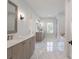 Luxurious bathroom with marble floors, double vanity, and soaking tub at 1012 Thatcher Way, Fort Mill, SC 29715