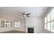 Open living room showcasing hardwood floors, fireplace, and ceiling fan at 1012 Thatcher Way, Fort Mill, SC 29715