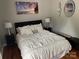 Bright bedroom with plush bedding and hardwood floors at 4845 Chesney Nw St, Concord, NC 28027