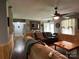 Living Room with hardwood floors, fireplace, and access to hallway at 129 Plank Barn Ln, Stony Point, NC 28678