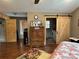 Primary bedroom with laundry access and barn door at 129 Plank Barn Ln, Stony Point, NC 28678