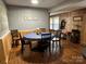 Bright dining area with wood floors and a round table at 129 Plank Barn Ln, Stony Point, NC 28678