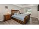 Bedroom with wooden furniture and lake view at 203 High Lake Dr, Statesville, NC 28677