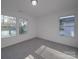 Bright bedroom with grey carpeting and large windows at 560 Geneva Cir, Gastonia, NC 28056