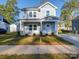 Two-story house exterior with landscaping and driveway at 560 Geneva Cir, Gastonia, NC 28056