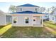 Rear view of a two-story house with a covered patio at 560 Geneva Cir, Gastonia, NC 28056