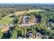 Aerial view of a neighborhood nestled in a wooded area at 560 Geneva Cir, Gastonia, NC 28056