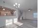 Sunlit dining area with hardwood floors and chandelier at 560 Geneva Cir, Gastonia, NC 28056