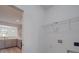 Bright laundry room with built-in shelving and access to kitchen at 560 Geneva Cir, Gastonia, NC 28056
