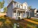 Two-story house exterior with landscaping and driveway at 560 Geneva Cir, Gastonia, NC 28056