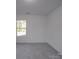 Simple bedroom featuring grey carpet and a window offering natural light at 560 Geneva Cir, Gastonia, NC 28056