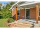 Inviting front porch with brick columns and steps at 2523 Kool Park Ne Rd, Hickory, NC 28601