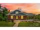 Brick house with gray trim, covered porch, and yard at 2523 Kool Park Ne Rd, Hickory, NC 28601