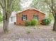 Brick house exterior with landscaping and trees at 1918 Waxhaw Hwy, Monroe, NC 28112