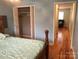 Bedroom with closet and view of hallway at 173/175 Landlubber Trl # H173/175, Mount Gilead, NC 27306