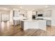 Modern kitchen with gray cabinets, white quartz island, and stainless steel appliances at 4457 Doyle Ridge Rd, Maiden, NC 28650