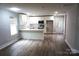 Modern kitchen with white cabinets, quartz countertops, and stainless steel appliances at 212 James St # 16, Kannapolis, NC 28083