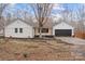 White ranch house with black garage door, landscaping, and a tree in the front yard at 3305 Cameo Trl, Gastonia, NC 28056