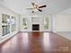 Spacious living room with hardwood floors, fireplace, and large windows at 325 Pelling Dr, York, SC 29745