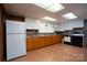 Basement kitchen with white appliances at 900 Nance St, Kannapolis, NC 28083