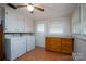 Laundry room with washer, dryer, and wood cabinets at 900 Nance St, Kannapolis, NC 28083