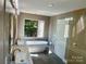 Elegant bathroom with double vanity, soaking tub, and walk-in shower at 1243 10Th Street Nw Pl, Hickory, NC 28601