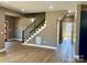 Elegant staircase featuring a modern design and hardwood flooring at 1243 10Th Street Nw Pl, Hickory, NC 28601